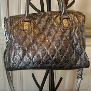 Vera Bradley quilted leather bag.